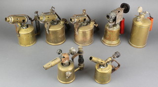 An Optimus blow lamp (dented), a no. 12 Vaporia blow lamp, Primus blow lamp, an Optimus no.431 blow lamp, 2 unmarked blow lamps and a brass herbicider  