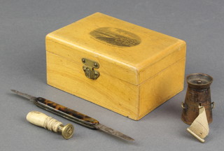 A Mocklyn box the lid decorated Bournemouth from the east cliff 2" x 3 1/2" x 2 1/2" containing a Victorian Austrian novelty metal tape measure 1",  a Victorian gilt metal seal and a pocket knife  