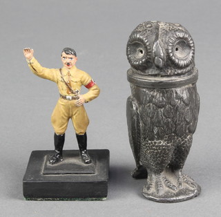 A Victorian metal pepperette in the form of a standing owl 3" (hardstone eyes missing), together with a metal figure of a standing Adolf Hitler 2 1/2" 