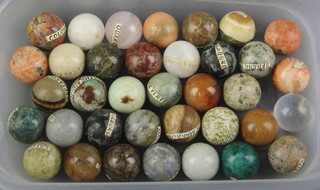 Thirty six spherical geological specimens