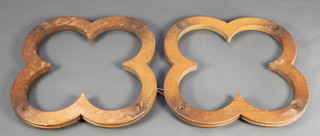 Two carved oak Gothic style shaped light fittings 29" diam. (fittings missing) 