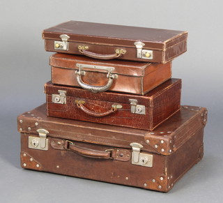 A brown leather suitcase with chrome mounts (slight scuffing to corners) 8"h x 22"w x 14"d, a brown simulated crocodile case with chrome mounts 4 1/2" x 15 1/2" x  10" (some scuffs to corners), a light brown leather case with metal patented handle 3 1/2" x 13 1/2" x 10 1/2", a Masonic briefcase 3 1/2 x 17 1/2" x 8" 