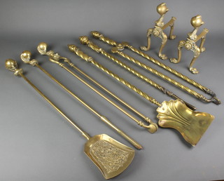 A Victorian brass 3 piece fireside companion set with spiral turned decoration comprising tongs, poker and shovel together with a 5 piece brass fireside companion set comprising pair of fire dogs tongs, poker and shovel all with egg and claw decoration 