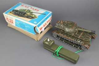 A Japanese tin plate model of a tank, boxed
