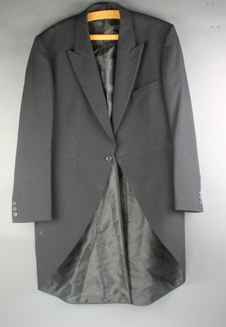 A gentleman's black tail coat size 40 (signs of wear) together with an evening tail coat by Bulaitis Peter & Sons approx. size 38 