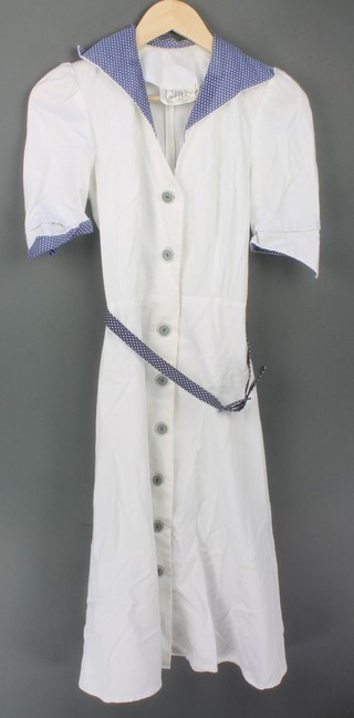 A white cotton Simon Jeffrey dress, a Mandy Marsh brown cotton dress, a Peter Robinson blue cotton 2 piece suit, a Quad white cotton dress 