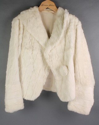 A lady's short white fur jacket and a brown fur coat (hole to arm) 