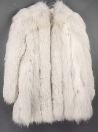 A lady's white quarter length fur jacket 