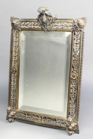 A 19th Century rectangular bevelled plate mirror contained in a pierced gilt metal frame surmounted by a figure of a cherub 14" x 10 1/2"