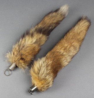 Of hunting interest, a preserved fox's brush with silver mount marked Cowdray Hunt December 12 1932 Pamela Scott Kilvert with silver mount and 1 other brush with plated mount 
