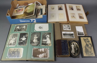 A Victorian leather bound photograph album, 2 later photograph albums and various photographs 