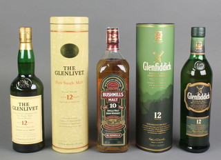 A 70cl bottle of The Glenlivet 12 year old single malt whisky, a 70cl bottle of 12 year old Glenfiddich single malt whisky and a litre bottle of Bushmills 10 year old single Irish malt whiskey 