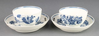 Two 18th Century Worcester blue and white tea bowls and saucers decorated with flowers  