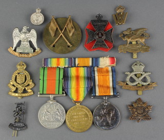 A group of 3 medals to G-89461 Pte. R H Taylor Middlesex Regt. comprising British War medal, Victory medal and Defence medal, Royal Scots Greys cap badge, Kings Royal Rifle Corps cap badge, Army Ordnance cap badge etc 