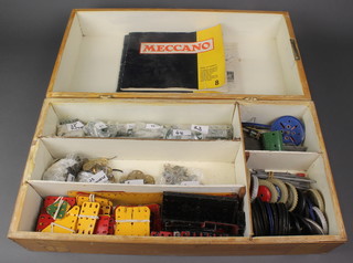 A quantity of yellow, green and blue Meccano together with a book of models no.7 and 8 