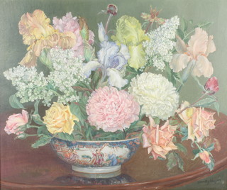Dorothy Noyes, oil on canvas, signed, a still life study of a bowl containing spring flowers 19" x 23 1/2" 