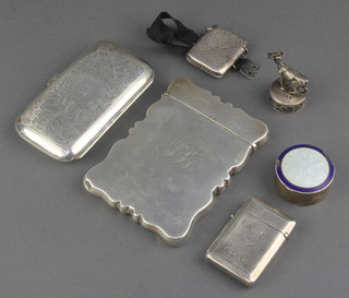 A silver card case with engraved inscription Birmingham 1919, 2 vestas, a cigarette case, pill box and top 