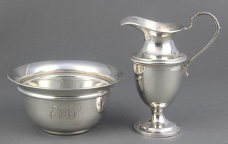 A silver cream jug of classical form Birmingham 1916 and a silver sugar bowl Sheffield 1924, 164 grams 