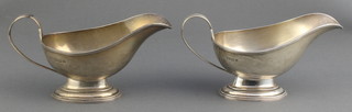 A pair of silver sauce boats with reeded handles London 1939, 250 grams