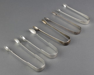 A pair of Victorian silver sugar nips London 1850 and 4 other pairs 