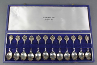 A set of 12 John Pinches silver Zodiac spoons London 1971, 280 grams