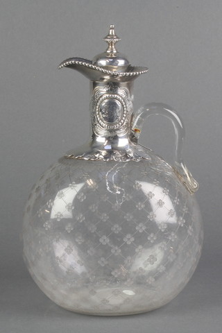 A mid Victorian silver mounted claret jug with bead decorated and chased armorial 9", hallmarks rubbed