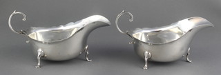 A pair of silver sauce boats with S scroll handle on pad feet, Chester 1924, 172 grams