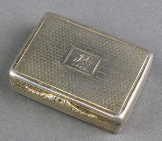A Victorian silver vinaigrette with engine turned decoration and pierced floral gilt grill, maker Nathaniel Mills, hallmarks rubbed, 1 3/4" x 1 1/2" 