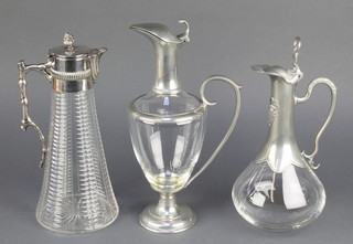 A silver plated mounted Edwardian ewer with rustic handle and faceted tapered body, 2 other ewers 