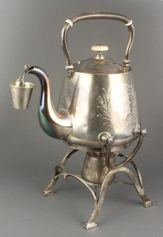 A Russian silver tea kettle on stand with burner and attached strainer pail, chased with leaves and a vacant cartouche having ivory knops, gross 1428 grams 