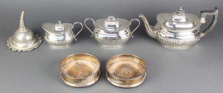 A silver plated 3 piece tea set with demi-fluted decoration, 2 coasters and a wine funnel 