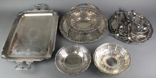 A silver plated 2 handled tray with chased decoration 23", 3 plated baskets, a paper knife and minor plated items