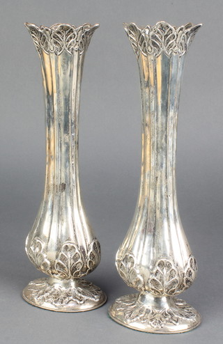 A pair of Edwardian repousse silver spill vases with acanthus decoration, Chester 1909 11" 