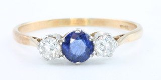An 18ct yellow gold sapphire and diamond ring, size R