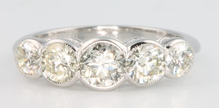 An 18ct white gold 5 stone diamond ring approx. 1.6ct, size N 