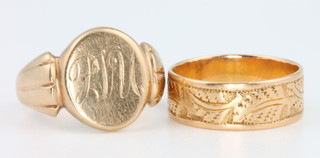 An 18ct yellow gold wedding band size J 1/4 - 4 grams and a 9ct yellow gold signet ring size I 1/2 - 6 grams
