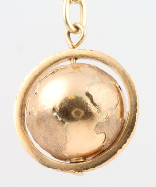 A gold chain with globe pendant 11 grams