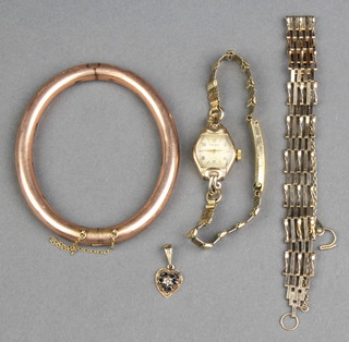 A 9ct yellow gold bangle, a ditto gate bracelet and a lady's wristwatch, weighable gold 16 grams 