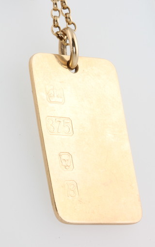 A 9ct yellow gold ingot pendant and chain, 24 grams