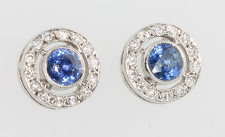 A pair of 18ct white gold sapphire and diamond ear studs