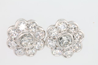 A pair of 18ct white gold 9 stone diamond cluster ear studs, approx 2.4ct