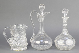 A cut glass ewer and stopper 13", a faceted decanter 12" and a water jug 
