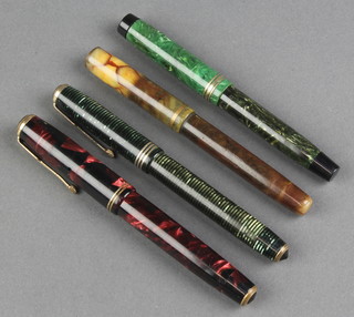 A lady's Parker vacumatic green marbled fountain pen, a red ditto and 2 other pens 