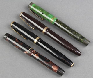 A gentleman's black Parker Duofold fountain pen, a burgundy ditto and 2 other pens