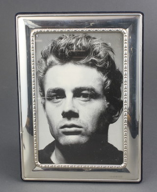 A rectangular silver photograph frame with beaded decoration 7 1/2" x 5 1/4" 