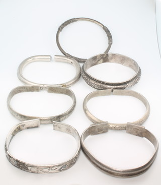 7 silver bangles and bracelets , 256 grams