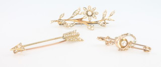 A 15ct yellow gold pearl set arrow brooch and 2 others