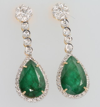 A pair of 18ct white gold diamond and emerald ear drops, the emeralds approx. 6.87ct, the brilliant diamonds approx. 1.02ct 