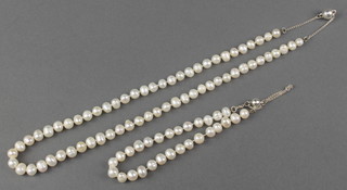 A modern baroque pearl necklace and bracelet with magnetic silver fittings