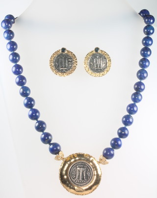 An 18ct yellow gold and lapis lazuli necklace in the Egyptian style together with a pair of ditto ear clips 